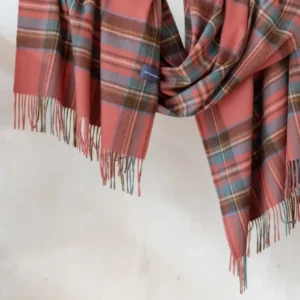 TBCo Stewart Royal Antique Tartan lambswool blanket scarf with fringing draped elegantly showing coral, blue and brown plaid pattern