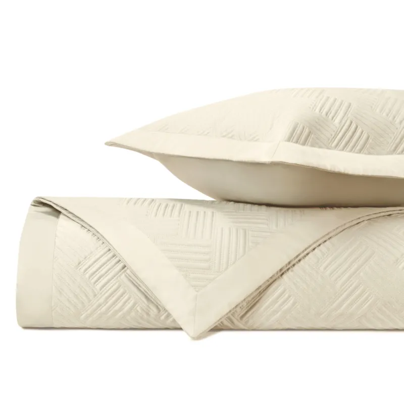 Home Treasures Twilight ivory quilted coverlet and euro sham with geometric pattern.